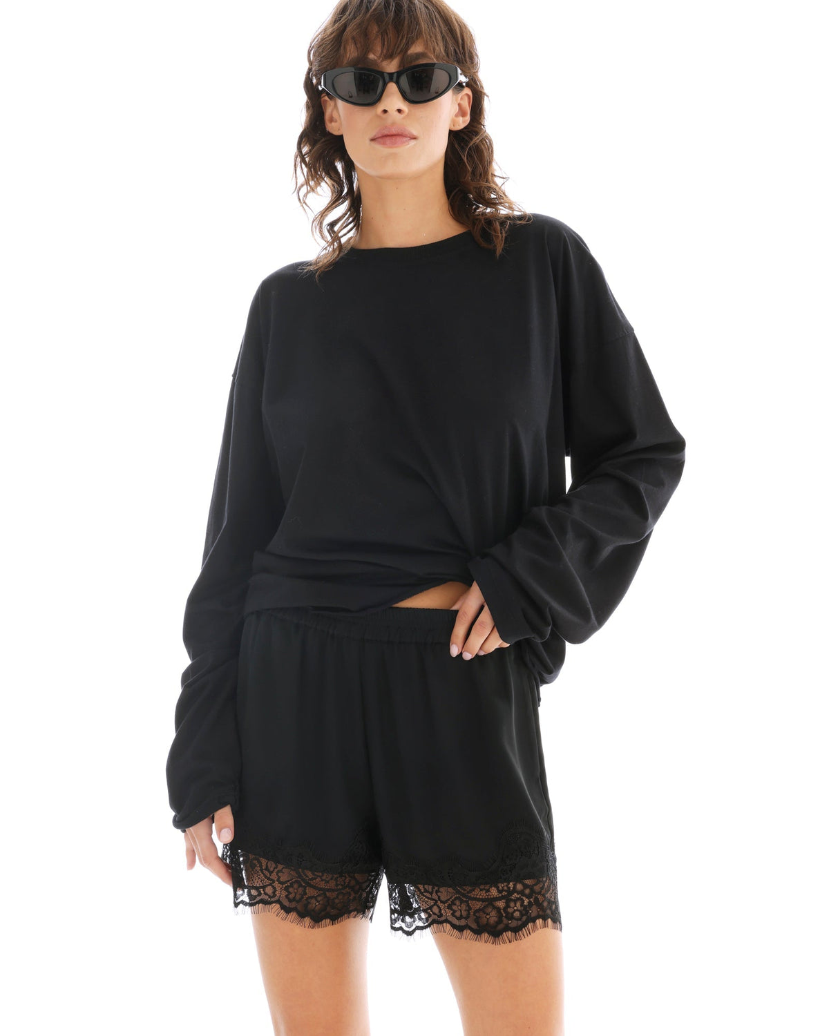 The Tales Lace Athena Shorts in Black, styled front