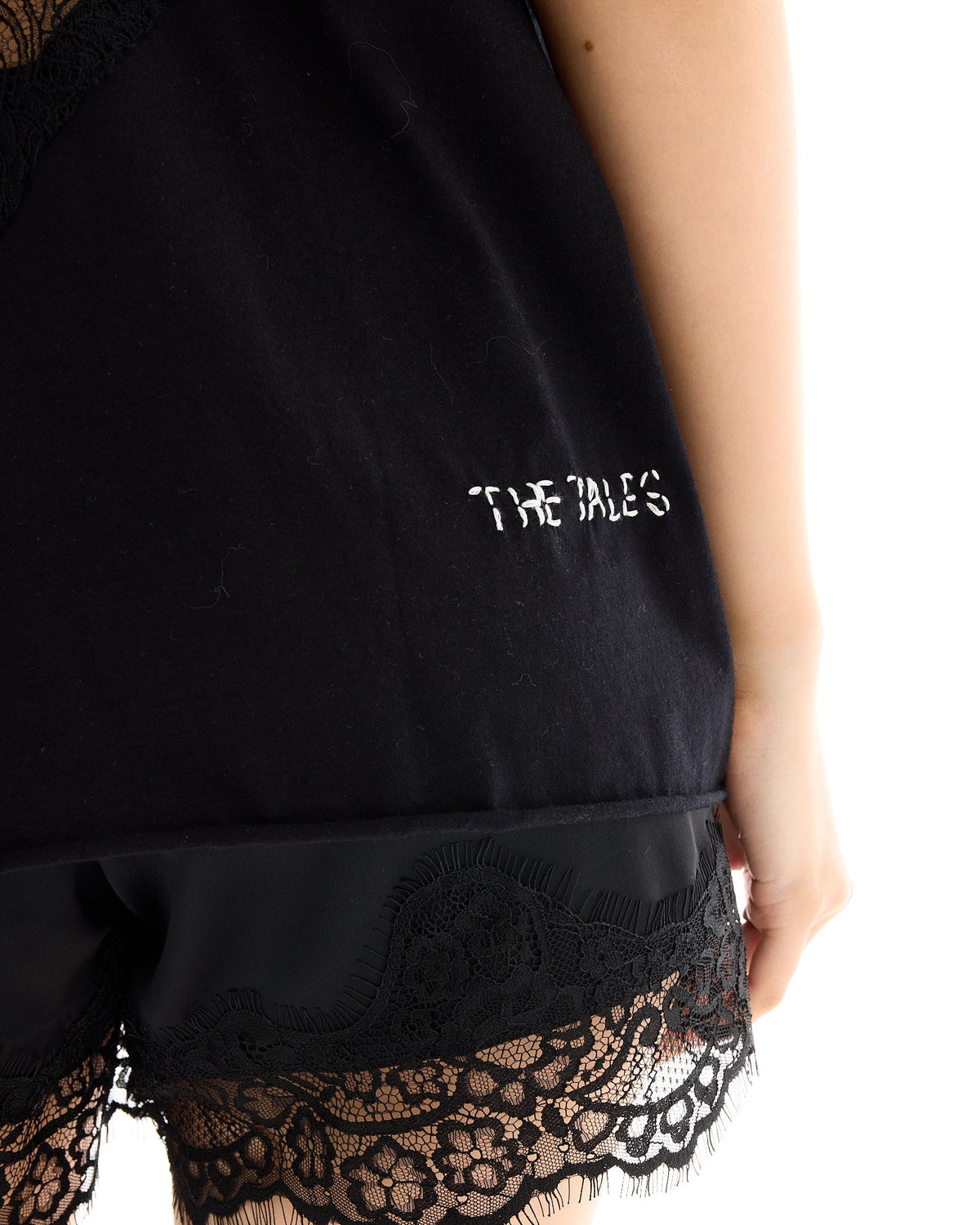 The Tales Lace Back Heart Street Tee in Black, embroidered logo detail